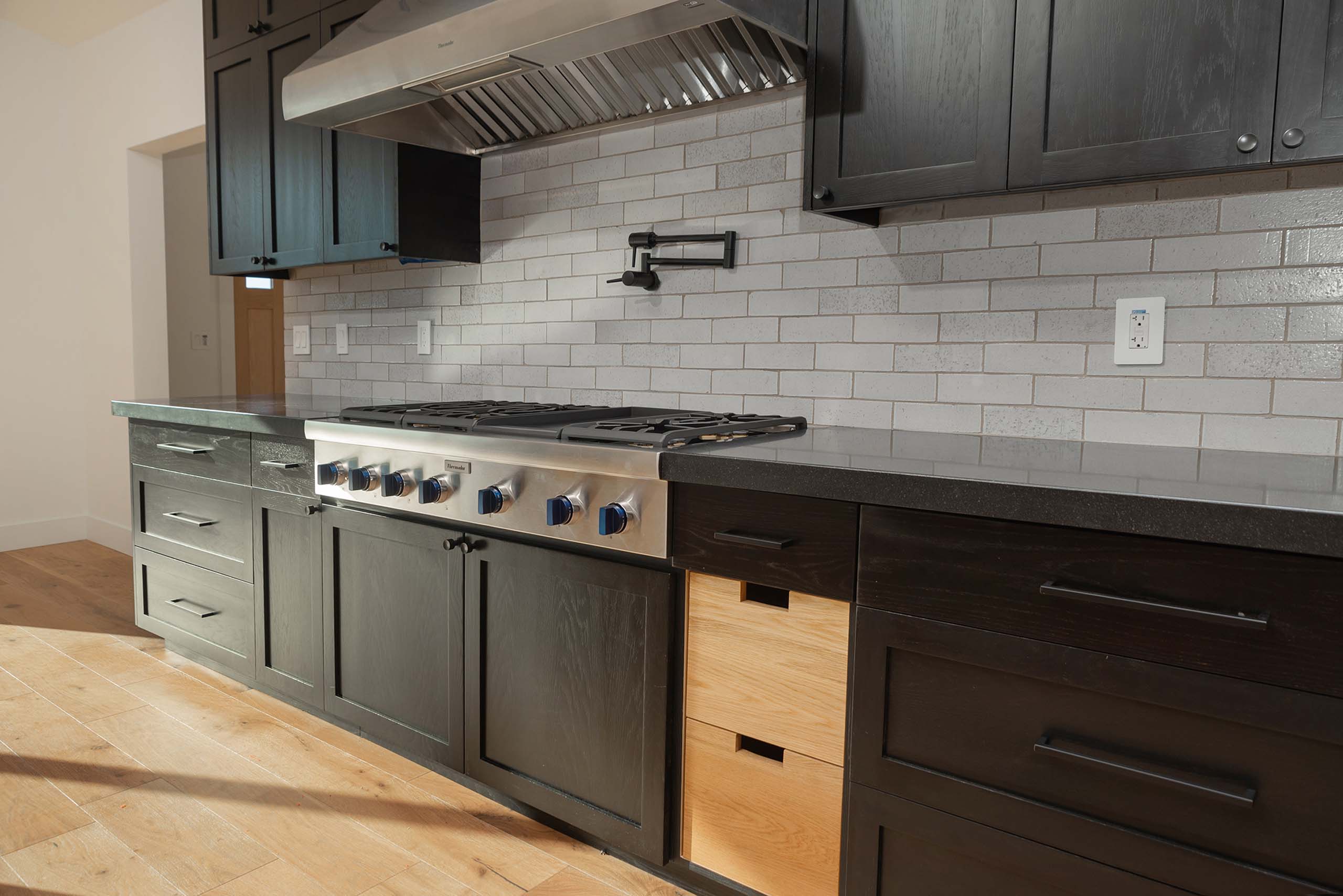 Stove in kitchen by Bridges Construction